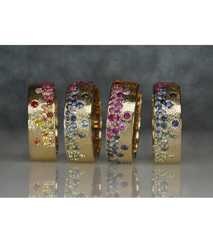 Raindrop rainbow sapphire ring collection.